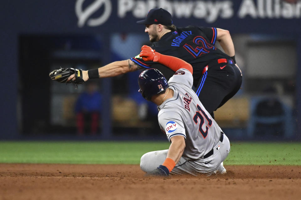 Toronto Blue Jays second baseman Spencer Horwitz (48) forces out Houston Astros' Yainer Diaz (21) at second base during the eighth inning of a baseball game in Toronto on Wednesday, July 3, 2024. (Jon Blacker/The Canadian Press via AP)