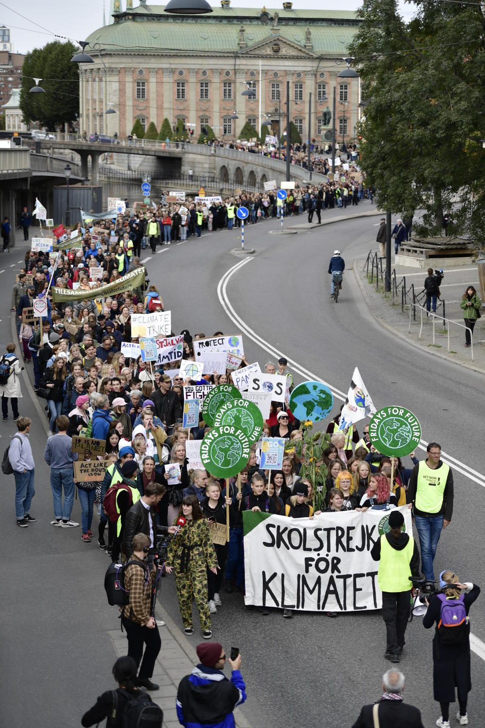Climate protesters demonstrate in central Stockholm, Sweden, Friday, Sept. 20, 2019. Protesters around the world joined rallies on Friday as a day of worldwide demonstrations calling for action against climate change began ahead of a U.N. summit in New York. (Stina Stjernkvist/TT via AP)