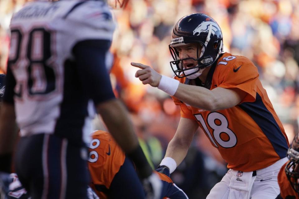 Denver Broncos quarterback Peyton Manning (18) calls out a play during the second half of the AFC Championship NFL playoff football game against the New England Patriots in Denver, Sunday, Jan. 19, 2014. (AP Photo/Charlie Riedel)