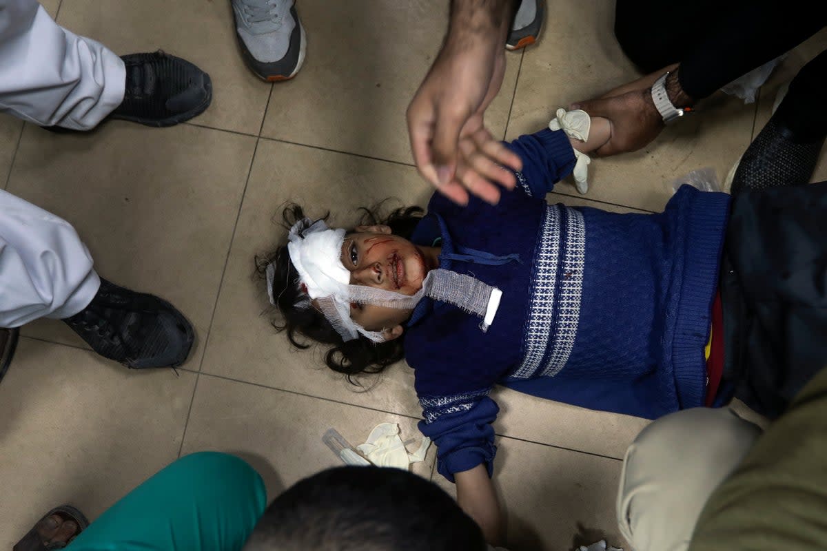 Palestinians wounded in the Israeli bombardment of the Gaza Strip are brought to Al Aqsa hospital in Deir al Balah, Gaza Strip, Monday, March 25, 2024. (AP Photo/Ismael Abu Dayyah)