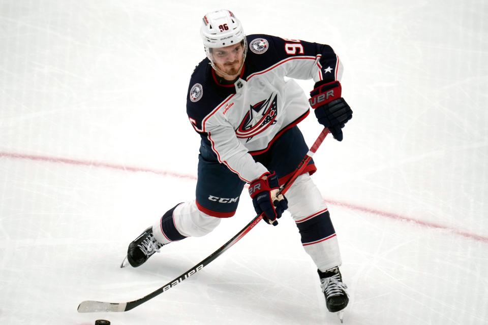 Columbus Blue Jackets' Jack Roslovic shoots for a goal against the Pittsburgh Penguins during the third period of an NHL hockey game Tuesday, March 5, 2024, in Pittsburgh. (AP Photo/Gene J. Puskar)