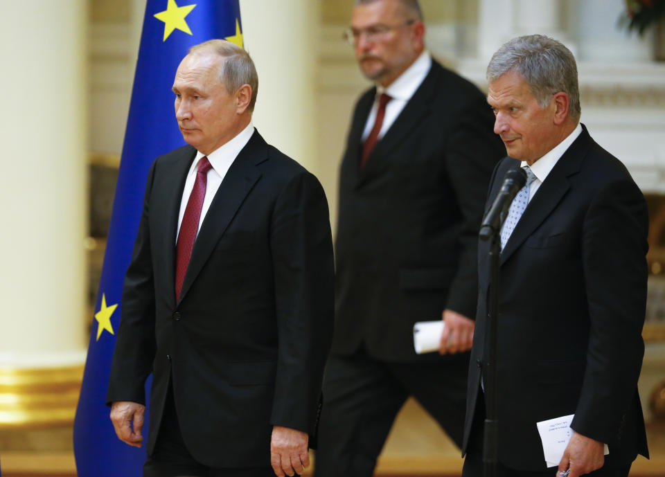 President of the Republic of Finland Sauli Niinisto, right, and Russian President Vladimir Putin walk to attend a news conference after their meeting at the President's official residence Mantyniemi in Helsinki, Finland, Wednesday, Aug. 21, 2019. (AP Photo/Alexander Zemlianichenko, Pool)