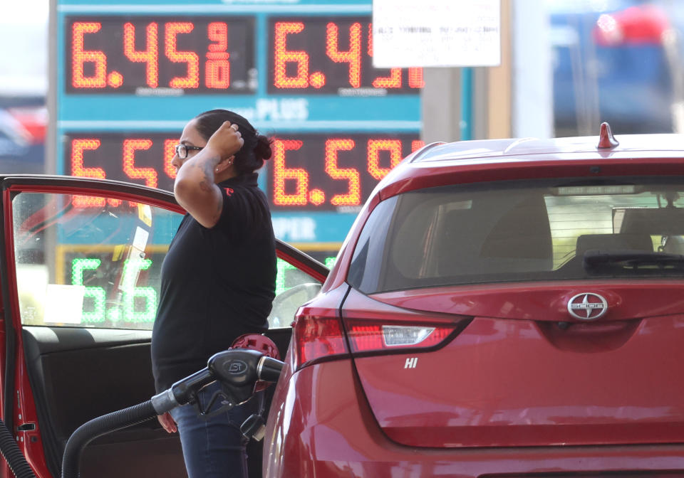 PETALUMA, CALIFORNIA - MAY 18: A customer pumps gas into their car at a gas station on May 18, 2022 in Petaluma, California. Gas prices in California have surpassed $6.00 per gallon for the first time ever. The average price per gallon of regular unleaded gasoline in California is at $6.05 and $6.29 in the San Francisco Bay Area. (Photo by Justin Sullivan/Getty Images)