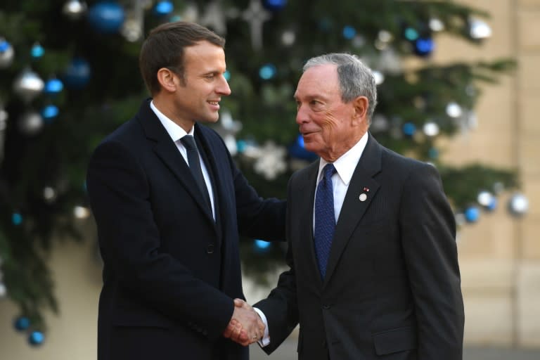 Former New York mayor Michael Bloomberg, seen with French President Emmanuel Macron at the Elysee Palace during the One Planet Summit, says President Trump's brushing off of climate issues is rallying people outside government to the cause