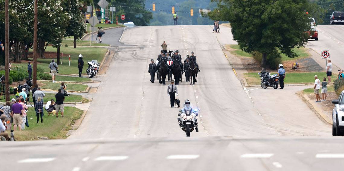 Slain Wake County Sheriffs Deputy Ned Byrds K9 partner, Sasha, leads the N.C. State Highway Patrols Caisson Unit during a procession for Deputy Byrd before his funeral at Providence Baptist Church in Raleigh, N.C., Friday, August 19, 2022.