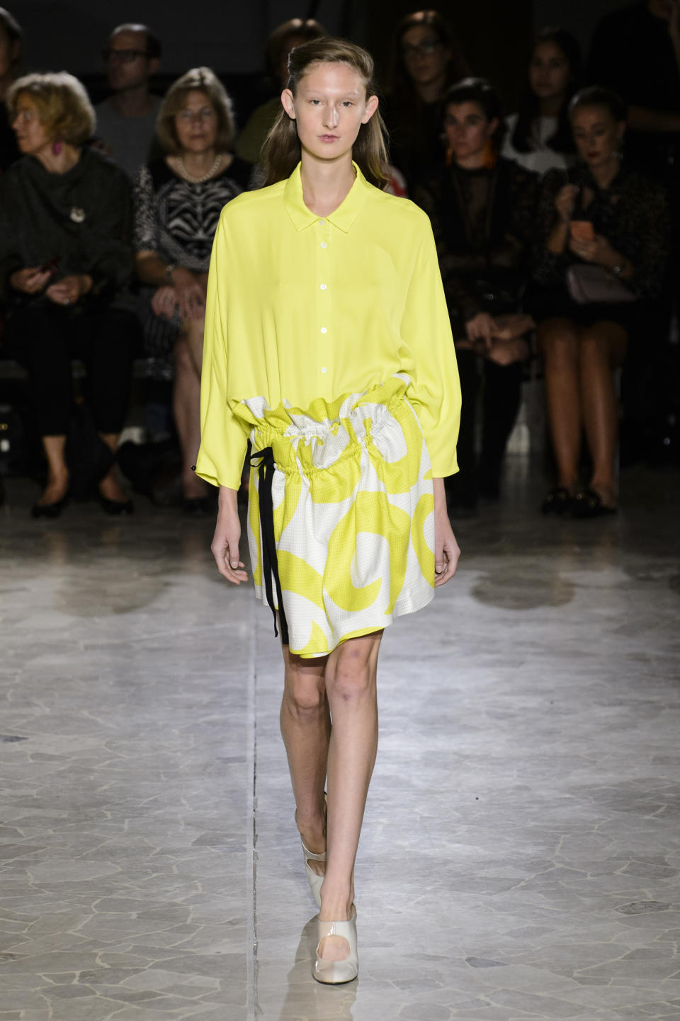 <p><i>Model wears a yellow blouse and pattern skirt from the SS18 Arthur Arbesser collection. (Photo: ImaxTree) </i></p>