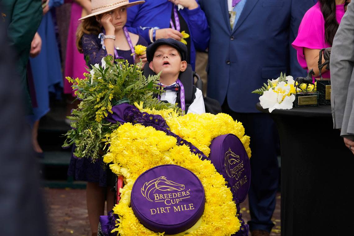 Cody Dorman, the namesake of Breeders’ Cup Dirt Mile winner Cody’s Wish, wears the winner’s flower sash after Saturday’s race at Keeneland.