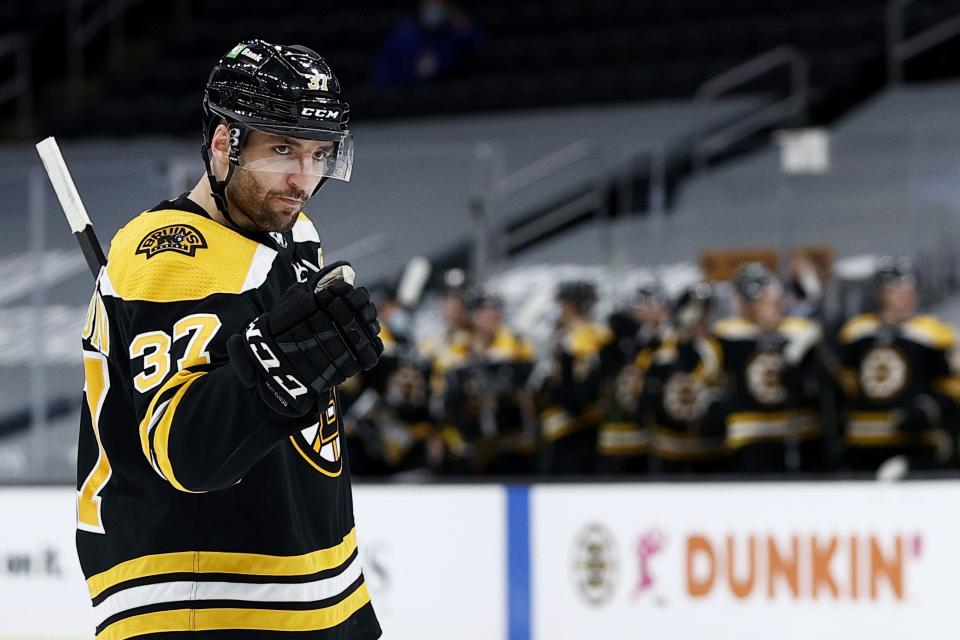 BOSTON, MASSACHUSETTS - JANUARY 28: Patrice Bergeron #37 of the Boston Bruins celebrates after scoring a goal against the Pittsburgh Penguins during the third period at TD Garden on January 28, 2021 in Boston, Massachusetts. The Bruins defeat the Penguins 4-1.  (Photo by Maddie Meyer/Getty Images)