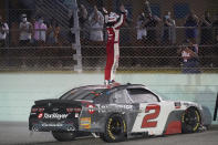 Myatt Snider stands on his car after winning the NASCAR Xfinity Series auto race Saturday, Feb. 27, 2021, at Homestead- Miami Speedway in Homestead, Fla. (AP Photo/Wilfredo Lee)