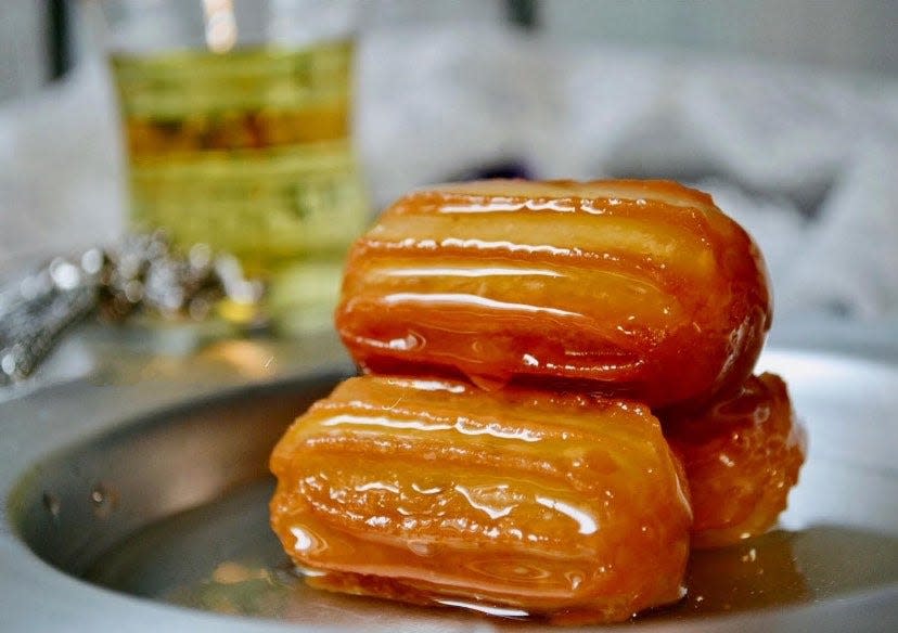 The traditional Bosnian pastry tulumba: fried choux pastry soaked in sugar syrup.