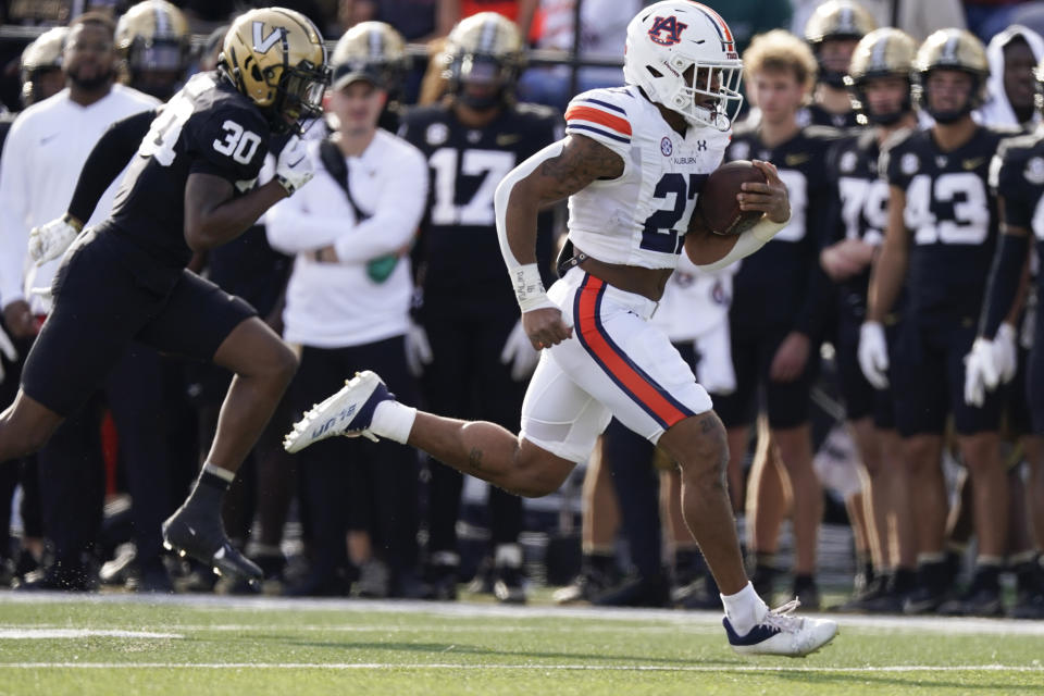 Auburn running back Jarquez Hunter (27) runs for a 67-yard touchdown against Vanderbilt in the first half of an NCAA college football game Saturday, Nov. 4, 2023, in Nashville, Tenn. (AP Photo/George Walker IV)