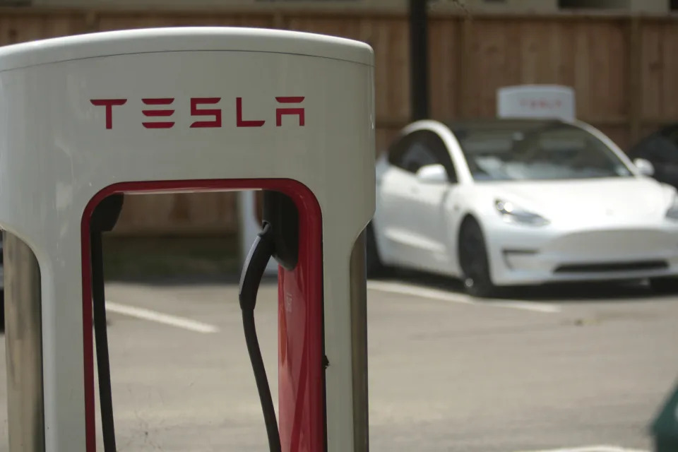 A Tesla supercharging location is seen on Kipling Street, June 3, 2024 in Houston. Charging stations have been hit particularly hard by thieves who likely want to sell the highly conductive copper wiring inside the cables at near-record prices. But authorities and charging company officials say similar thefts are increasing across the U.S. as more charging stations are built. (AP Photo/Lekan Oyekanmi)