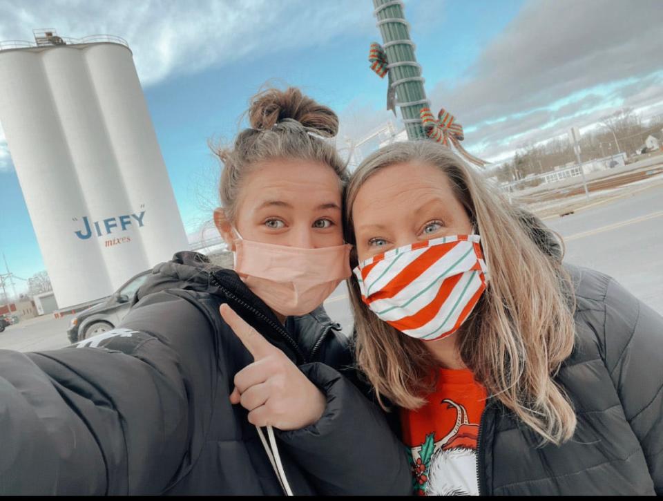 Abby Thomas, 17, of Fowlerville, a Fowlerville High senior, left, who earned her driving hours by delivering food to people at the start of the COVID-19 pandemic and her mom, Jill Thomas, in Chelsea, Mich.