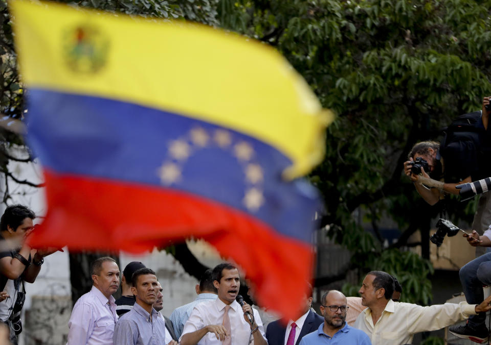 Venezuela's opposition leader and self-proclaimed interim president Juan Guaido talks during a rally in Caracas, Venezuela, Monday, April 1, 2019. He’s backed by more than 50 nations, which consider Nicolas Maduro’s presidency illegitimate following what they call sham elections last year. “We must unite now more than ever,” said Guaido earlier in the day. "We must mount the biggest demonstration so far to reject what’s happening." (AP Photo/Natacha Pisarenko)