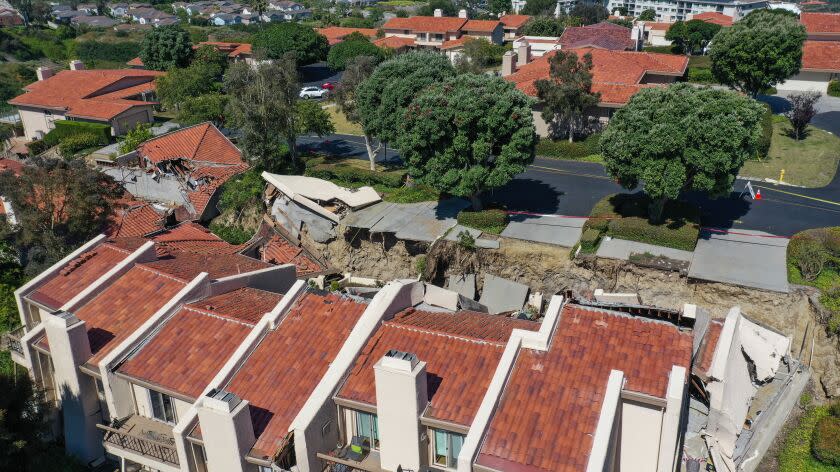 Rolling Hills Estates, CA - July 10: A drone's eye view of home in a gated community along Peartree Ln in Rolling Hills Estates, CA, the morning after several began sliding down a canyon, Monday, July 10, 2023. Neighbors said they began noticing movement of driveways at the street intersections starting Friday, July 7, but houses began to collapse and become inhabitable on Sunday, July 9. (Jay L. Clendenin / Los Angeles Times)