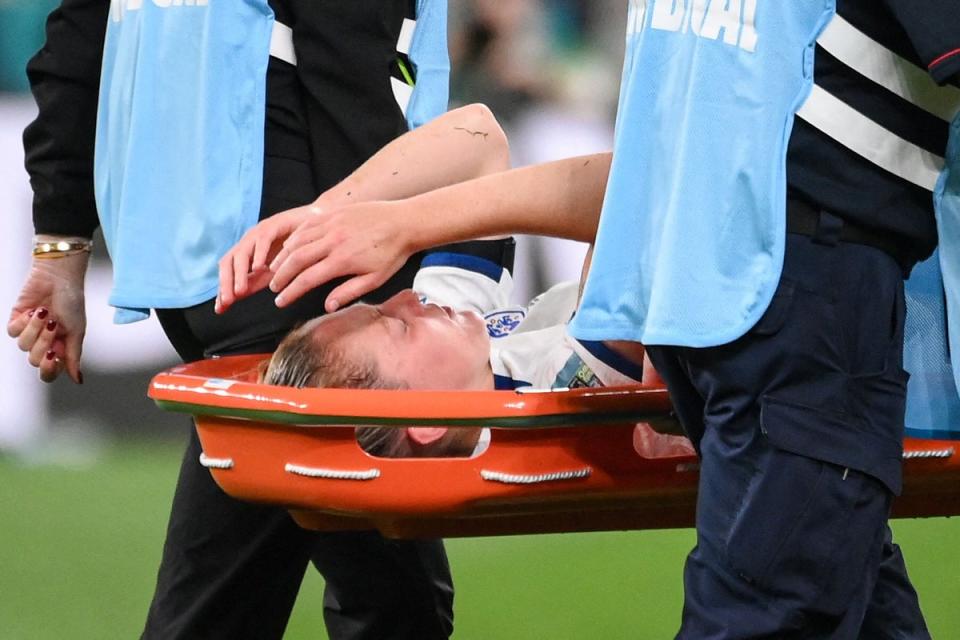 Walsh appeared to be in serious pain as she was stretchered off (AFP via Getty Images)