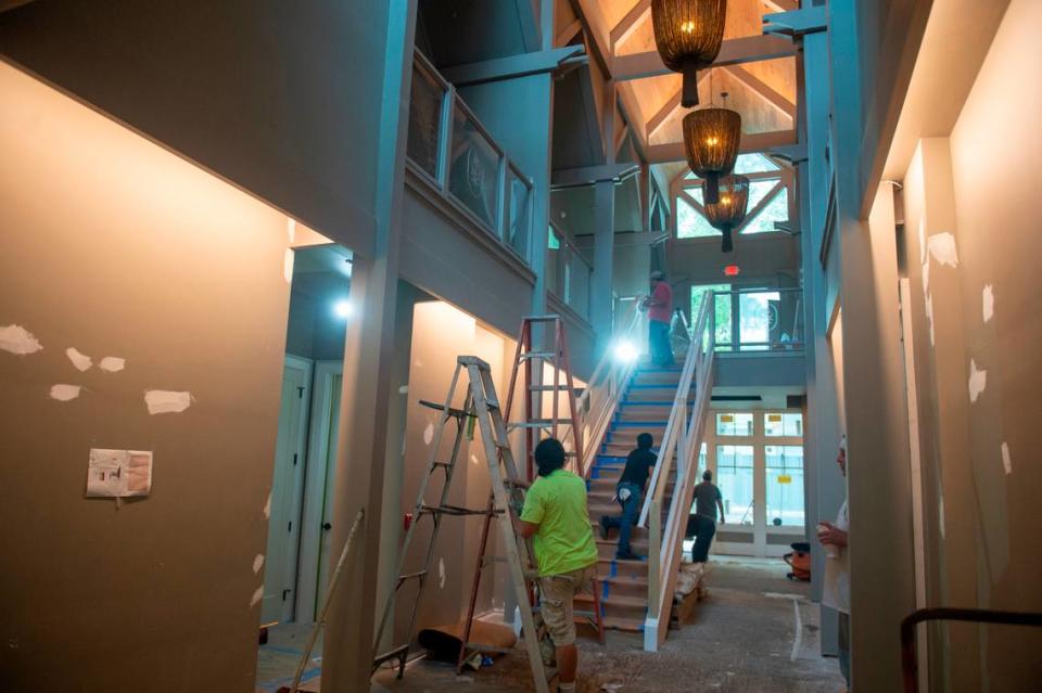 Crews work on the main stairwell of The Springs Hotel while it’s under construction in the downtown.
