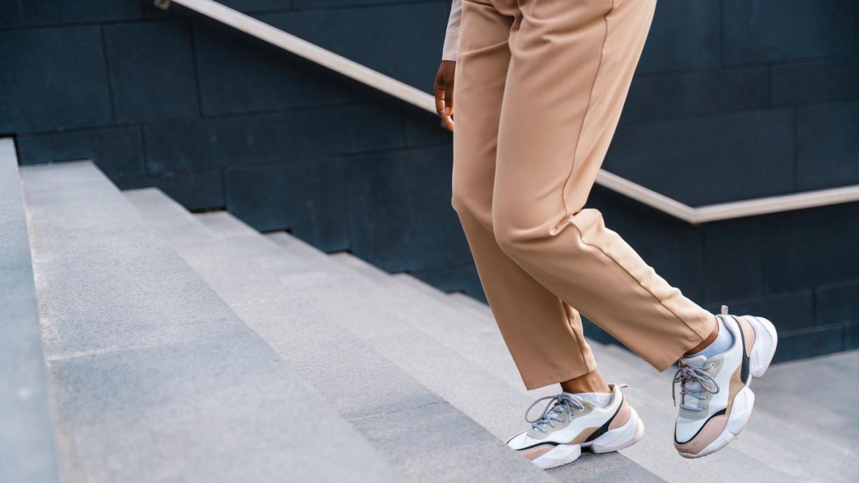 a female legs, ascending the stairs