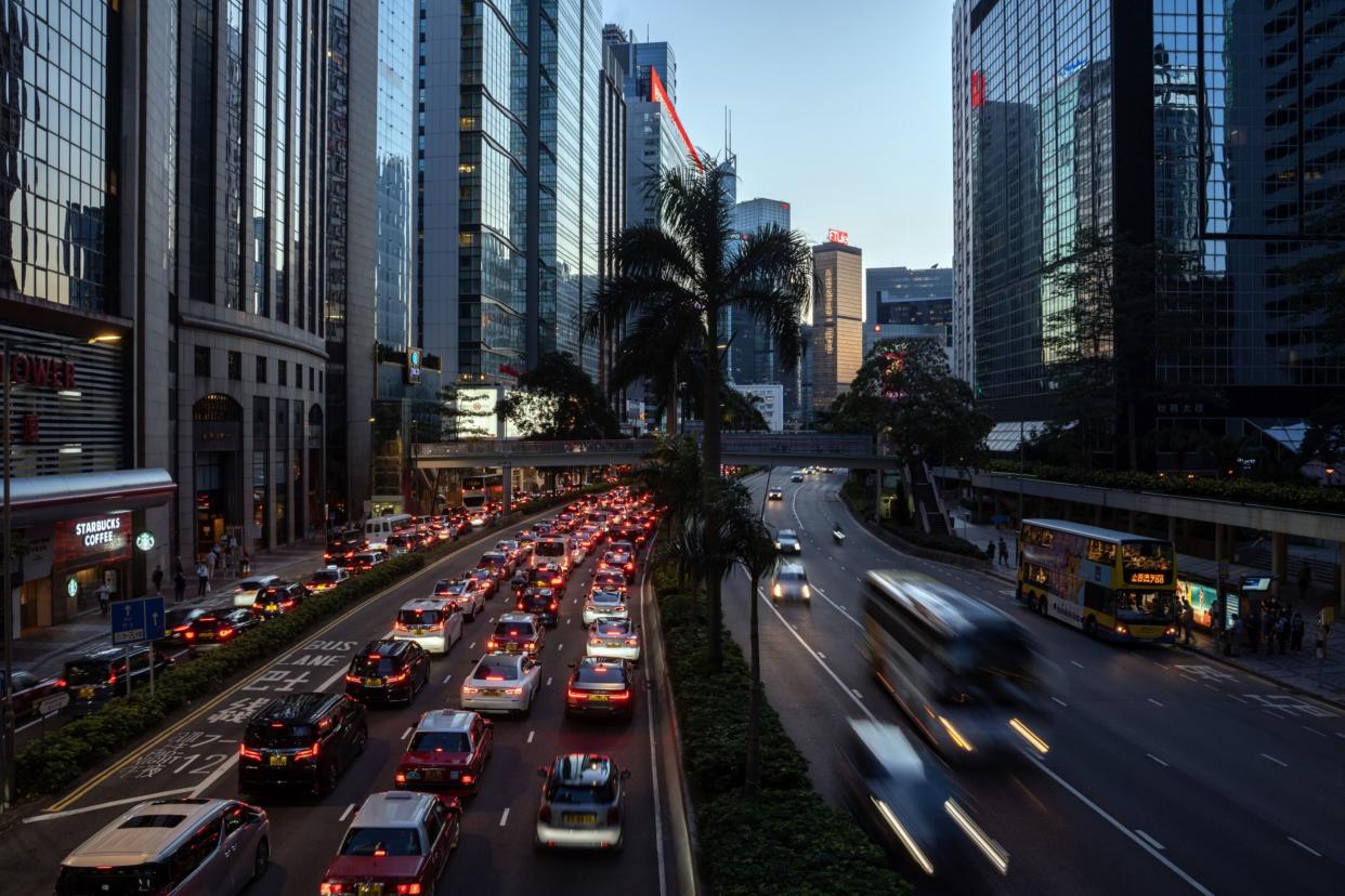 Vehicles travel along a road in Hong Kong, China, on Tuesday, June 28, 2022. (Bloomberg)