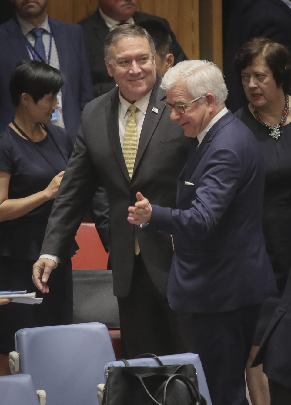 United States Secretary of State Michael Pompeo, center, and Foreign Minister of Poland Jacek Czaputowicz, second from right, arrive for a meeting of the United Nations Security Council on the Mideast, Tuesday Aug. 20, 2019 at U.N. headquarters. (AP Photo/Bebeto Matthews)