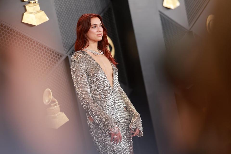 Grammy nominee Dua Lipa, whose song Dance The Night from the Barbie soundtrack is up for song of the year, walks the red carpet during the Grammy Awards on Sunday evening.