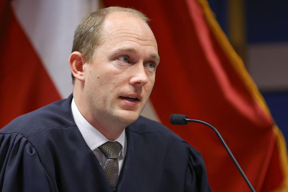 FILE- Fulton County Superior Judge Scott McAfee presides over a hearing is to determine whether Fulton County District Attorney Fani Willis should be removed from the case because of a relationship with Nathan Wade, special prosecutor she hired in the election interference case against former President Donald Trump, Friday, March, 1, 2024, in Atlanta. Scott McAfee, who's presiding over the election interference case, drew two challengers Friday, March 8, 2024, for his nonpartisan race in May: civil rights attorney Robert Patillo and Tiffani Johnson, a staff attorney for another Fulton County judge. (AP Photo/Alex Slitz, Pool, File)