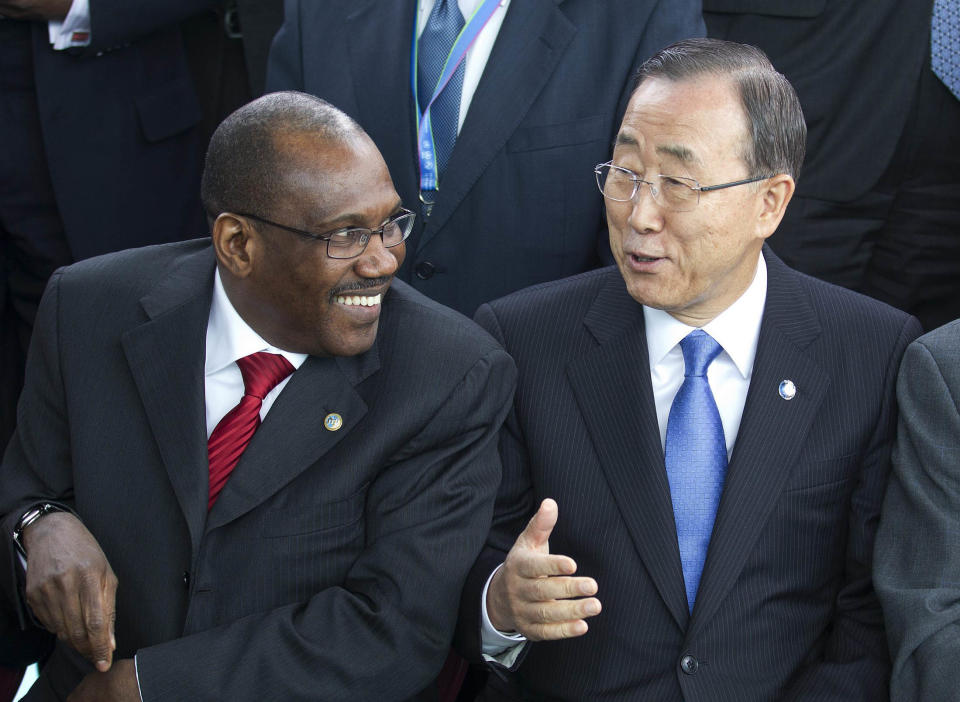 FILE - In this April 13, 2012, file photo United Nations Secretary-General Ban Ki-moon, center, speaks with Hamadoun Toure, Secretary-General of the International Telecommunication Union (ITU),during a photo session of the UN Chief Executive Board in Geneva, Switzerland. Secret negotiations, preparing for a first-ever summit on international telecommunications, have sparked a wave of rumors, the juiciest of which has the UN seizing control of the Internet from a coalition of nongovernmental organizations that establish web policies, standards and rules. Toure, who will be running the World Conference on International Telecommunications in Dubai this December calls the rumor “ridiculous.” (AP Photo/Keystone, Salvatore Di Nolfi)