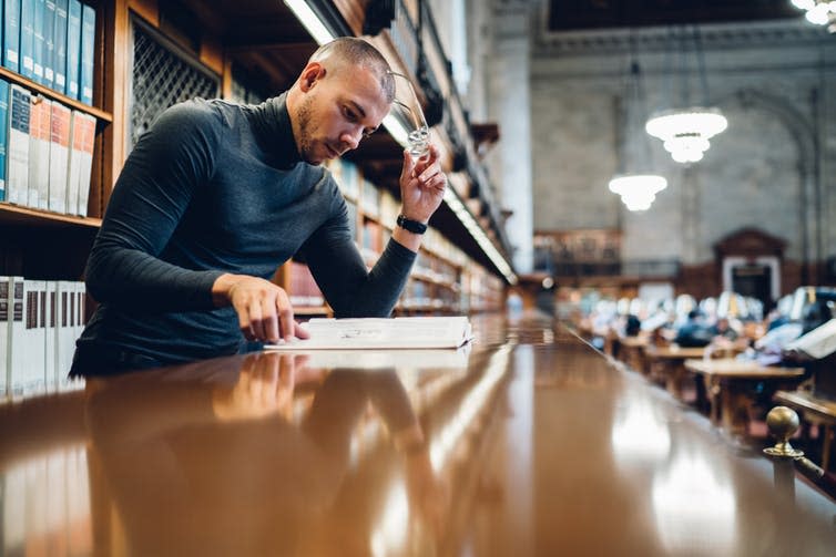 <span class="caption">My research indicates that working-class students and academics avoid top universities.</span> <span class="attribution"><a class="link " href="https://www.shutterstock.com/image-photo/concentrated-male-journalist-analyzing-content-book-1018042453" rel="nofollow noopener" target="_blank" data-ylk="slk:GaudiLab/Shutterstock;elm:context_link;itc:0;sec:content-canvas">GaudiLab/Shutterstock</a></span>