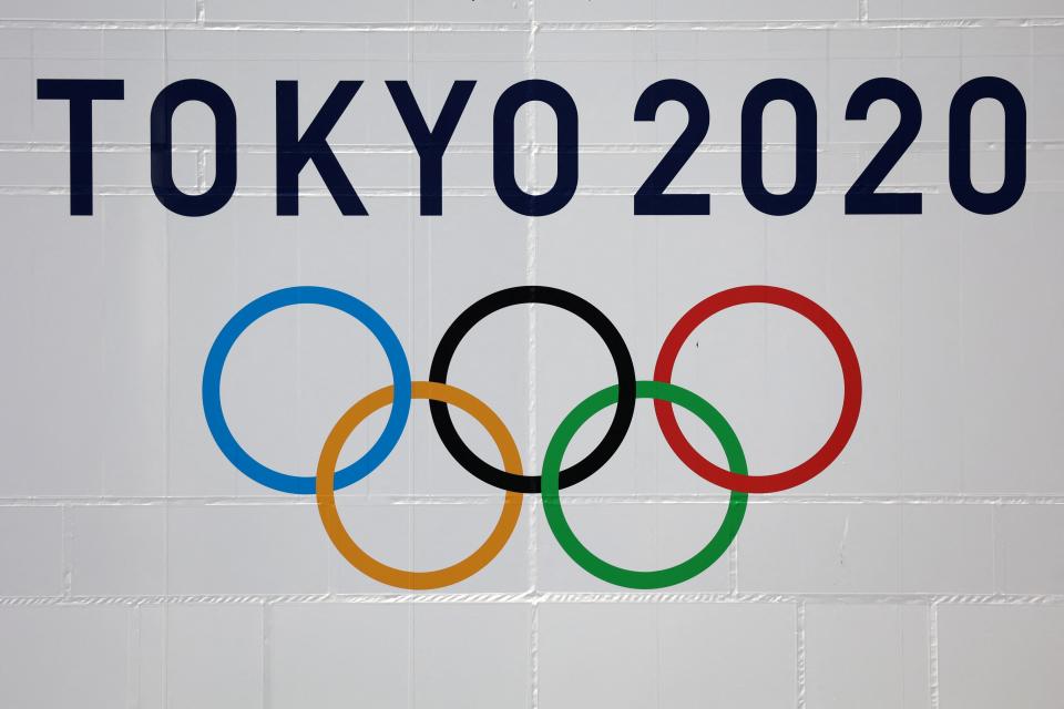 An official Tokyo 2020 Olympic Games logo is seen on the Tokyo metropolitan government building on April 7, 2021. (Photo by Yuki IWAMURA / AFP) (Photo by YUKI IWAMURA/AFP via Getty Images)