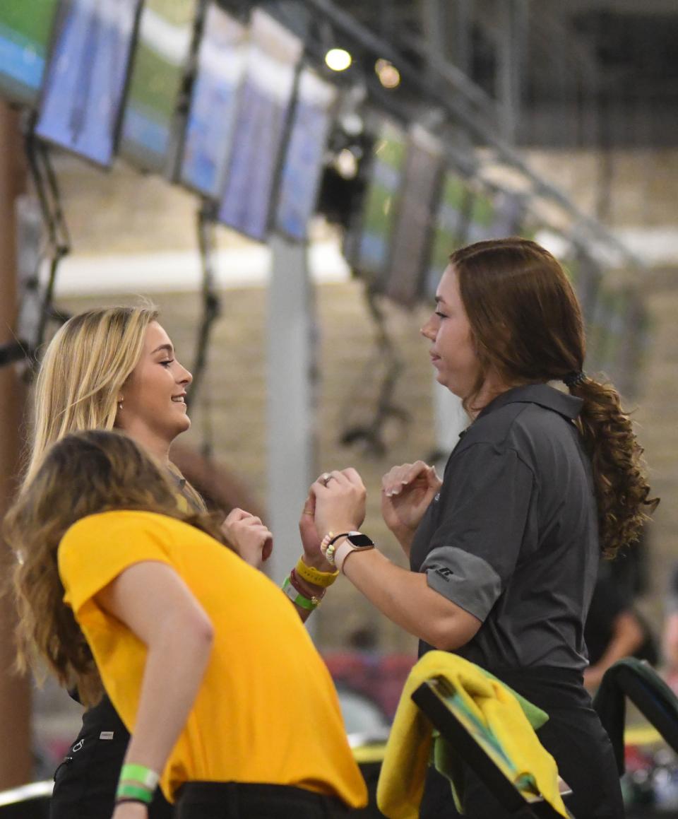 Etowah's Ellington Jones (left) is congratulated by teammate Anna Jones during the second day of the AHSAA state bowling championships Friday, Jan. 28, 2022 in Gadsden, Alabama.