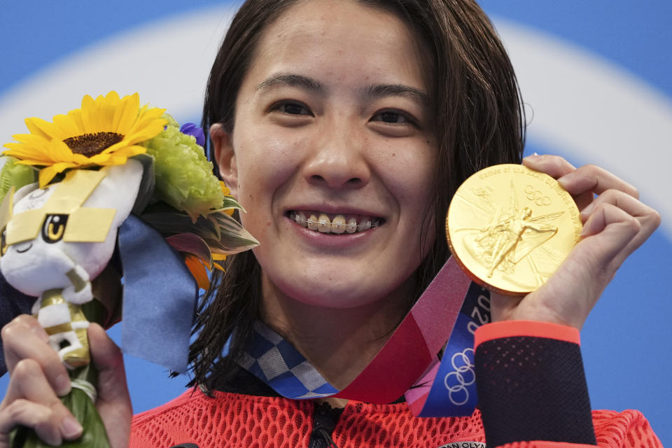 Yui Ohashi of Japan poses with her gold medal for the women's 200-meter individual medley final at the 2020 Summer Olympics, Wednesday, July 28, 2021, in Tokyo, Japan. (AP Photo/Matthias Schrader)