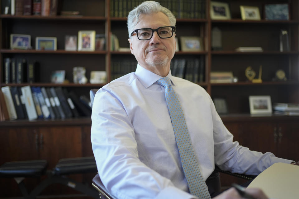 Judge Juan Merchan poses for a picture in his chambers in New York, Thursday, March 14, 2024. Merchan could become the first judge ever to oversee a former U.S. president’s criminal trial. He's presiding over Donald Trump’s hush money case in New York. (AP Photo/Seth Wenig)