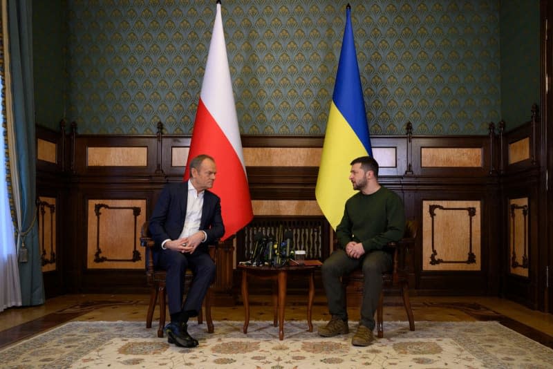 Ukrainian President Volodymyr Zelensky (R) and Polish Prime Minister Donald Tusk (L) hold a meeting at the Mariinskyi Palace. -/Ukraine Presidency/dpa