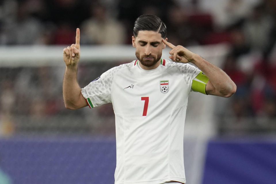 Iran's Alireza Jahan Bakhsh celebrates after scoring his side's second goal during the Asian Cup semifinal soccer match between Iran and Qatar at Al Thumama Stadium in Doha, Qatar, Wednesday, Feb. 7, 2024. (AP Photo/Aijaz Rahi)