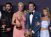 Brett Goldstein, from left, Hannah Waddingham, Jason Sudeikis and Juno Temple pose with their award for outstanding supporting actor in a comedy series, outstanding supporting actress in a comedy series, outstanding lead actor in a comedy series and outstanding comedy series for "Ted Lasso" at the 73rd Primetime Emmy Awards on Sunday, Sept. 19, 2021, at L.A. Live in Los Angeles. (AP Photo/Chris Pizzello)