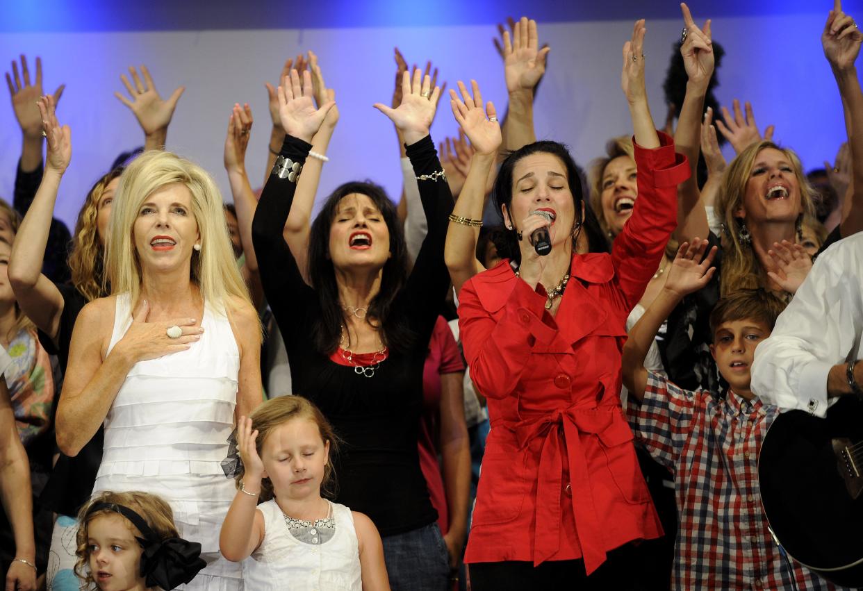 Remnant Fellowship Church founder Gwen Shamblin, left, sings with others from the church during services in June 2011 in Brentwood.