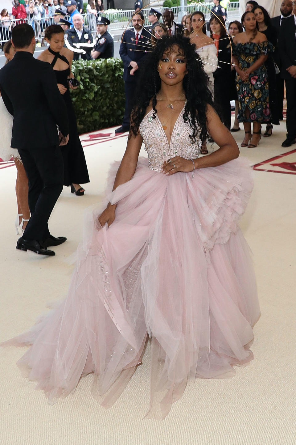 Woman in a voluminous tulle gown with embellished bodice on the red carpet