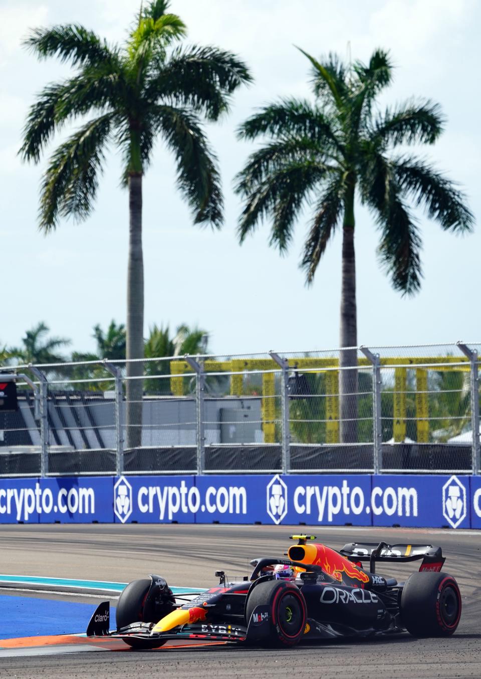 May 6, 2022; Miami Gardens, Florida, USA; Red Bull driver Sergio Perez of Mexico races into turn 1 through the circuit during qualifying for the Miami Grand Prix at Miami International Autodrome.