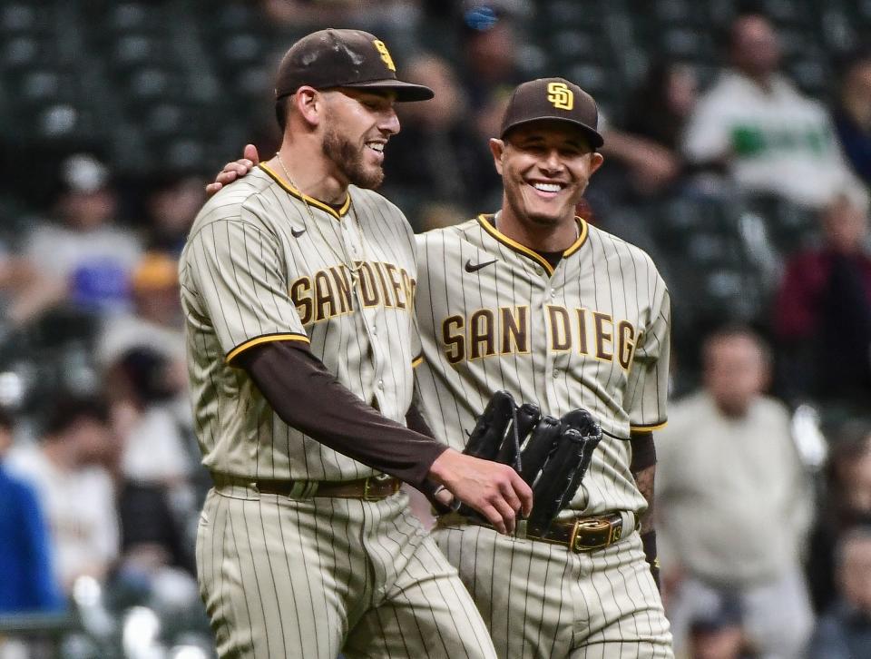 Joe Musgrove and Manny Machado during a game in Milwaukee.