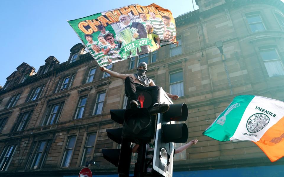 Celtic fans celebrate after winning the cinch Premiership in the city centre in Glasgow