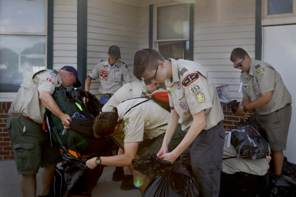 Boy Scouts with a Downs, Ill., troop prepare their luggage before boarding a westbound Amtrak train for a 14-day camping trip in New Mexico, Tuesday, June 15, 2021, Galesburg, Ill, (AP Photo/Shafkat Anowar)