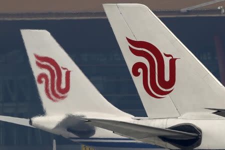 Flights of Air China are parked on the tarmac of Beijing Capital International Airport in Beijing, China, March 28, 2016.REUTERS/Kim Kyung-Hoon/File Photo