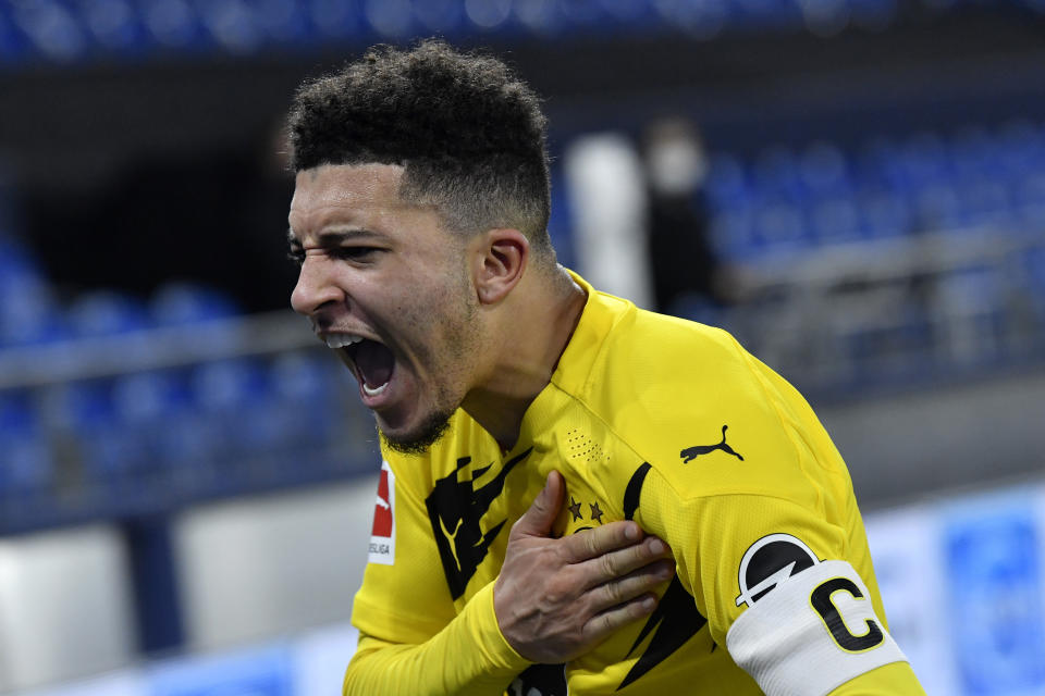 Dortmund's Jadon Sancho celebrates at the end of the German Bundesliga soccer match between FC Schalke 04 and Borussia Dortmund in Gelsenkirchen, Germany, Saturday, Feb. 20, 2021. Dortmund won 4-0. (AP Photo/Martin Meissner, Pool)