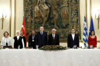 Greek Prime Minister Alexis Tsipras, his partner Peristera Baziana, Greek President Prokopis Pavlopoulos, Turkish President Tayyip Erdogan and his wife Emine Erdogan attend a state dinner at the Presidential Palace in Athens, Greece, December 7, 2017. REUTERS/Costas Baltas