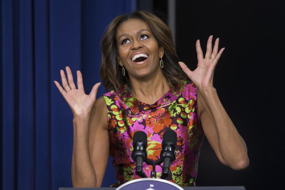 First lady Michelle Obama reacts as she introduces the cast of "The Trip to Bountiful" after a screening the movie, Monday, Feb. 24, 2014, in the South Court Auditorium on the White House complex in Washington. (AP Photo/ Evan Vucci)