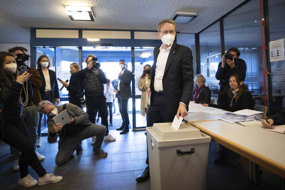 Daniel Gunther (CDU), Minister President of Schleswig-Holstein and top candidate for his party, casts his vote at the Stadtwerke Eckernf'rde polling station, in Eckernforde, Germany, Sunday, May 8, 2022. The northern German state of Schleswig-Holstein is holding an election Sunday that offers a test at the ballot box for Chancellor Olaf Scholz’s government amid its handling of the war in Ukraine. Polls before the election for the state legislature point to a solid lead for the center-right Christian Democratic Union, which is in opposition at the national level. (Christian Charisius/dpa via AP)