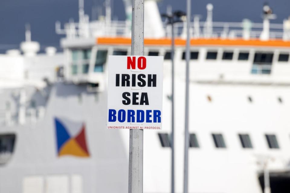 A sign on a lamppost outside Larne Port with the word ‘No Irish Sea Border’ (Liam McBurney/PA) (PA Archive)