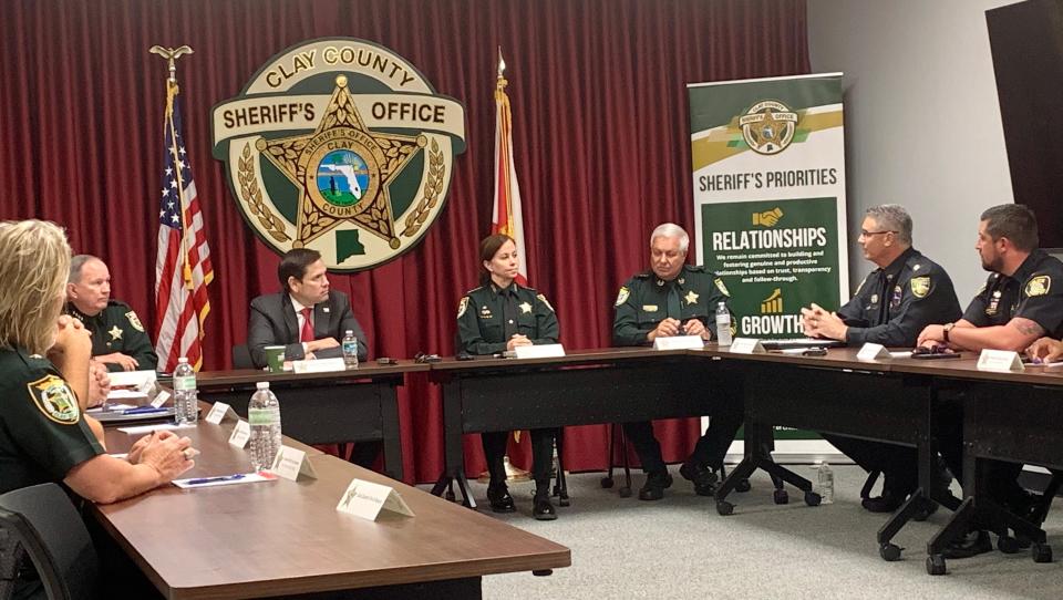 U.S. Sen. Marco Rubio, flanked by Nassau County Sheriff Bill Leeper and Clay County Sheriff Michelle Cook, listens as Steve Gallaher, chief of the homeland security division for the Jacksonville Sheriff's Office, talks about police efforts to disrupt the sale of fentanyl, an extremely powerful opiate.