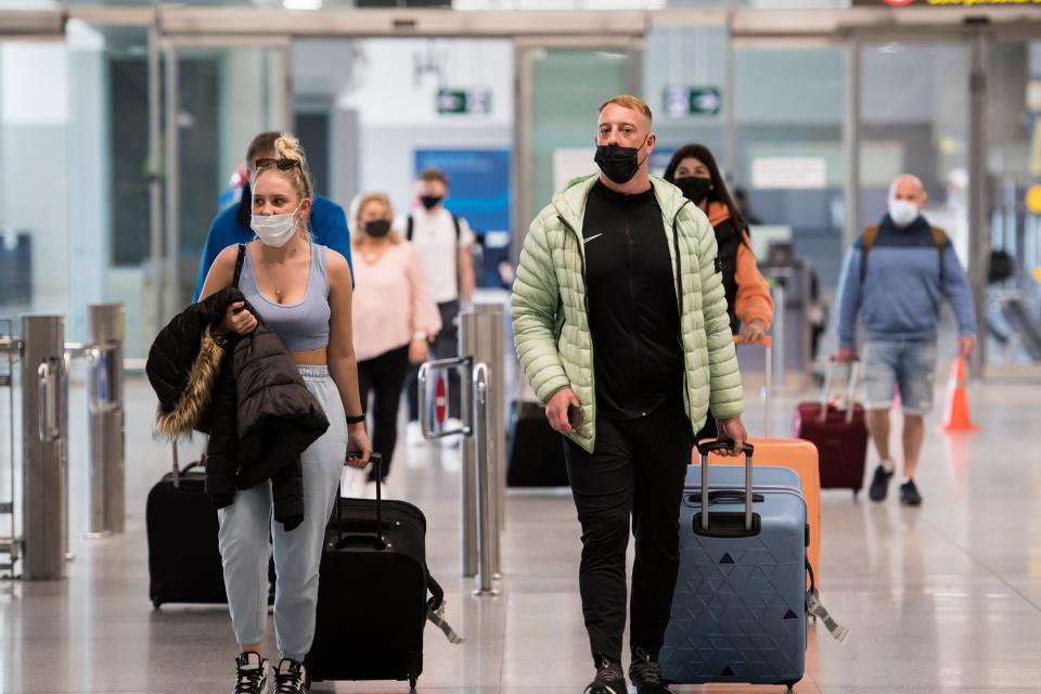 Travellers arrive in Malaga on a flight from London (Getty Images)