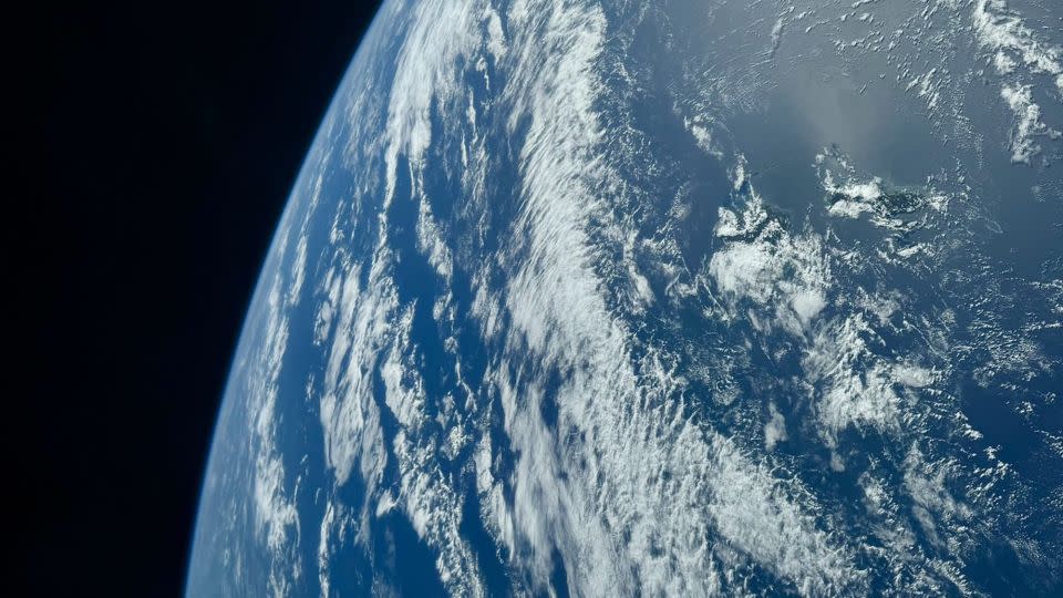 The crew members snapped a photo showcasing their view of Earth from the Crew Dragon capsule. - From Polaris/X